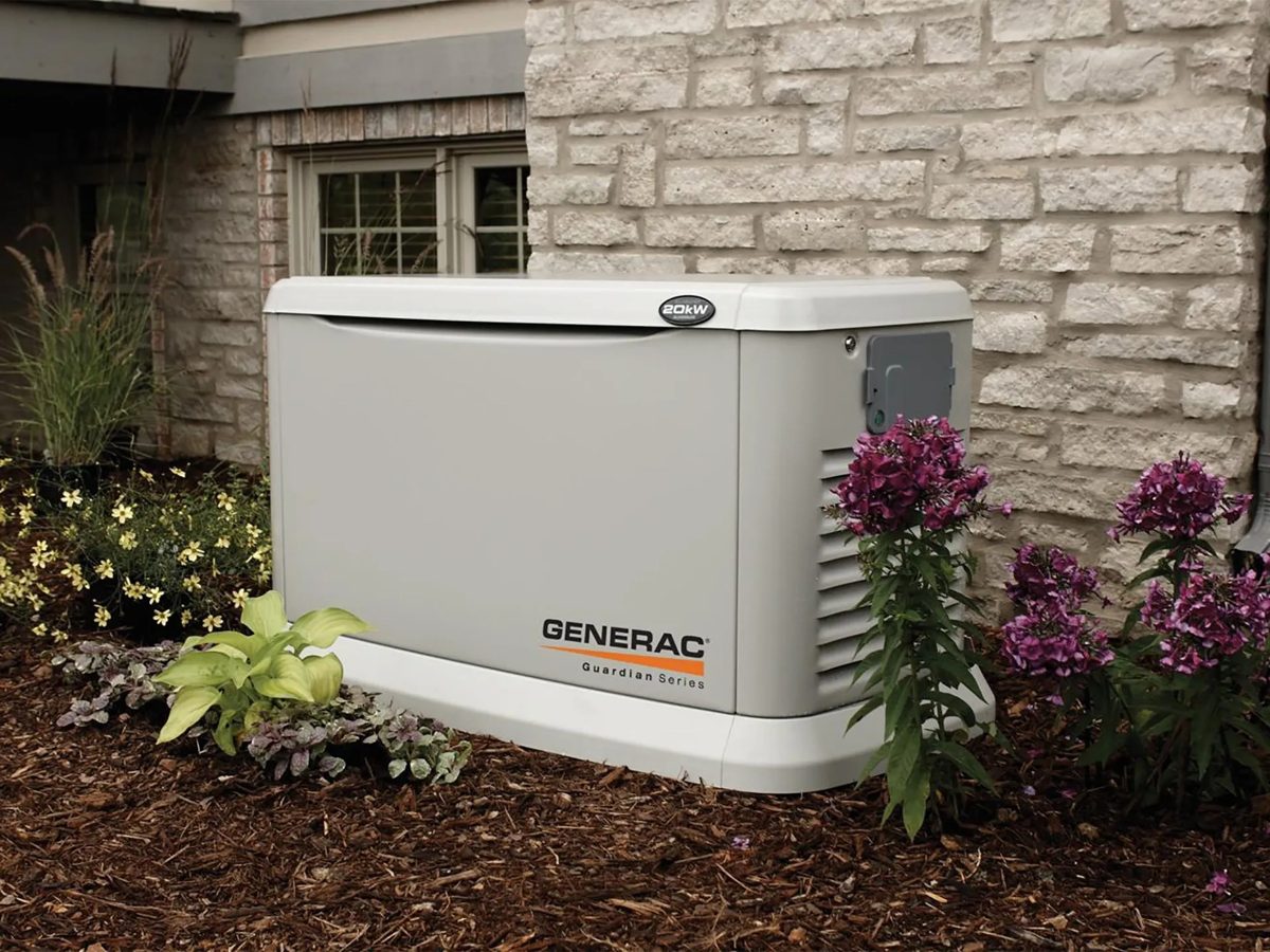 Generac Guardian Series standby generator beside a home